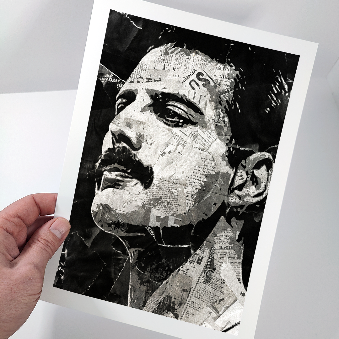 A Freddie Mercury poster design - a portrait of Freddie made using a collage of torn pieces of magazine pages in black and white.